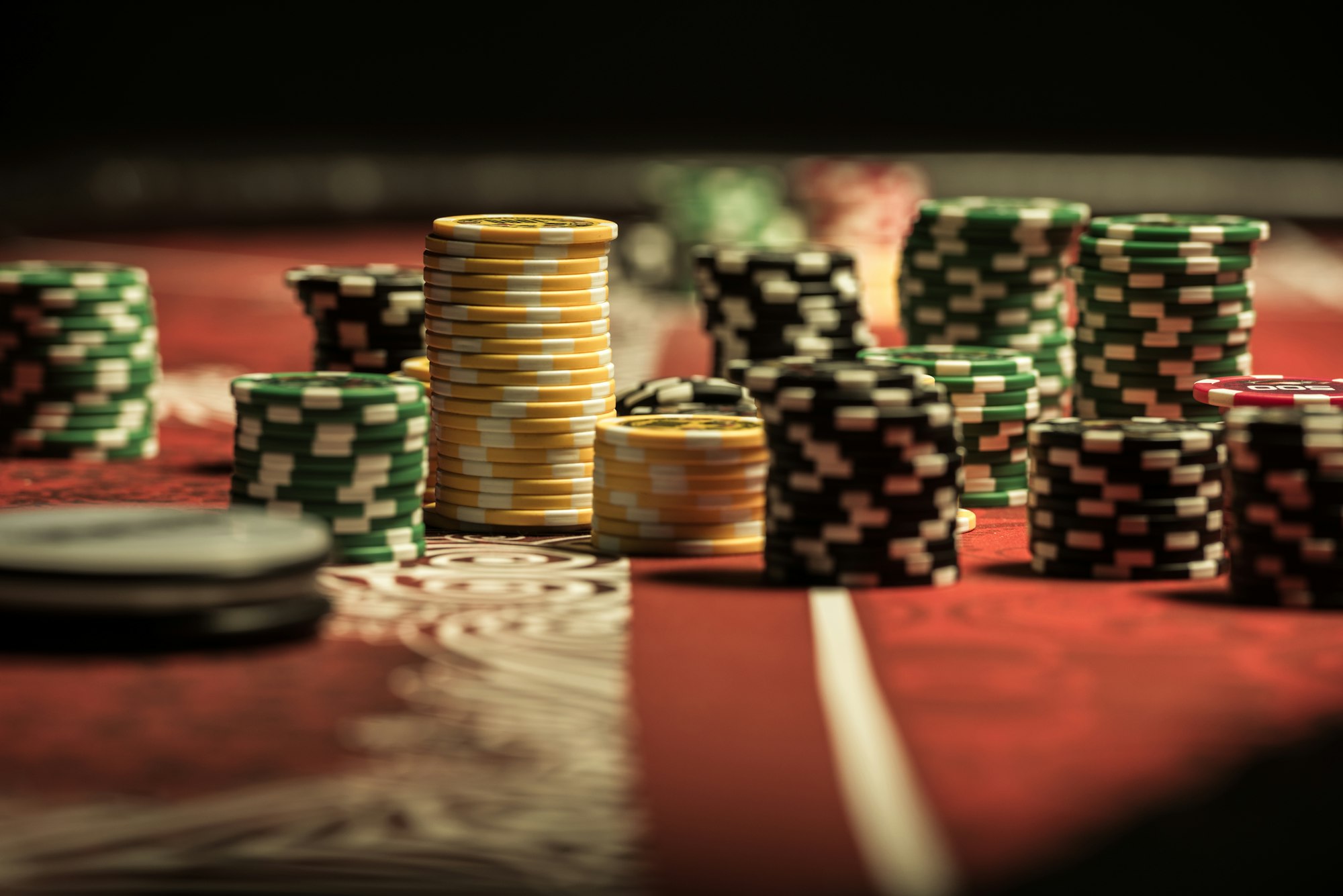 Close-up view of poker chips on poker table at casino