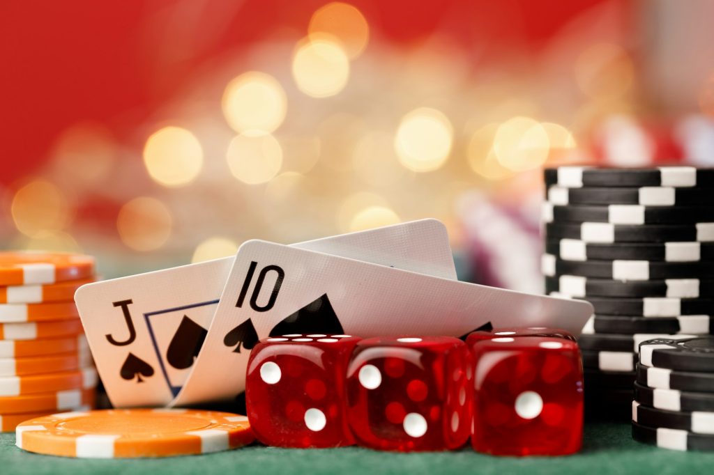 Playing cards on poker table background close up