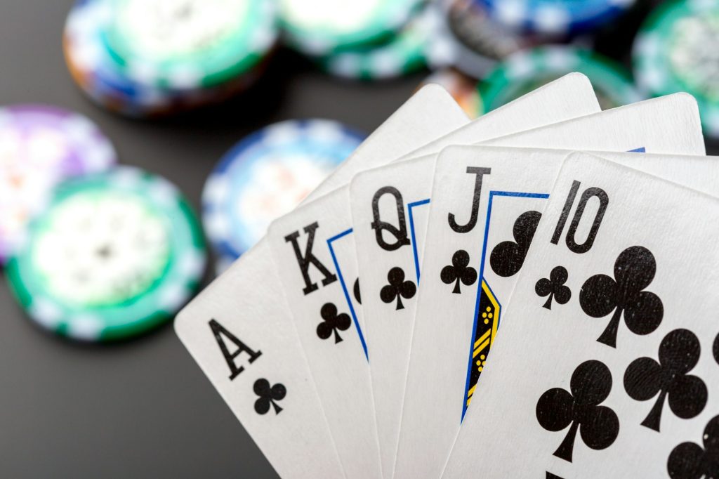 poker chips and cards on black background